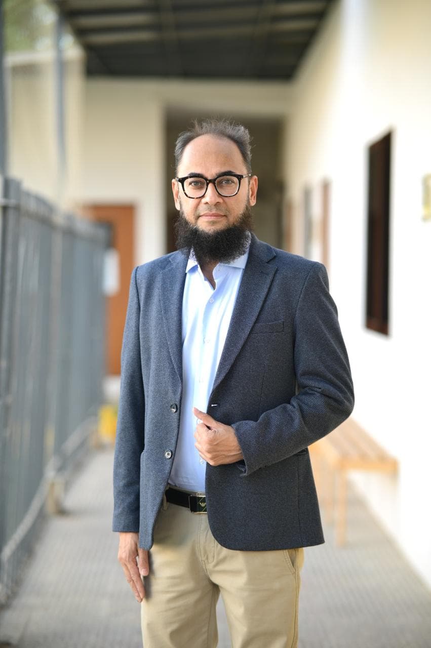 Shahab Yakoob standing in a professional portrait